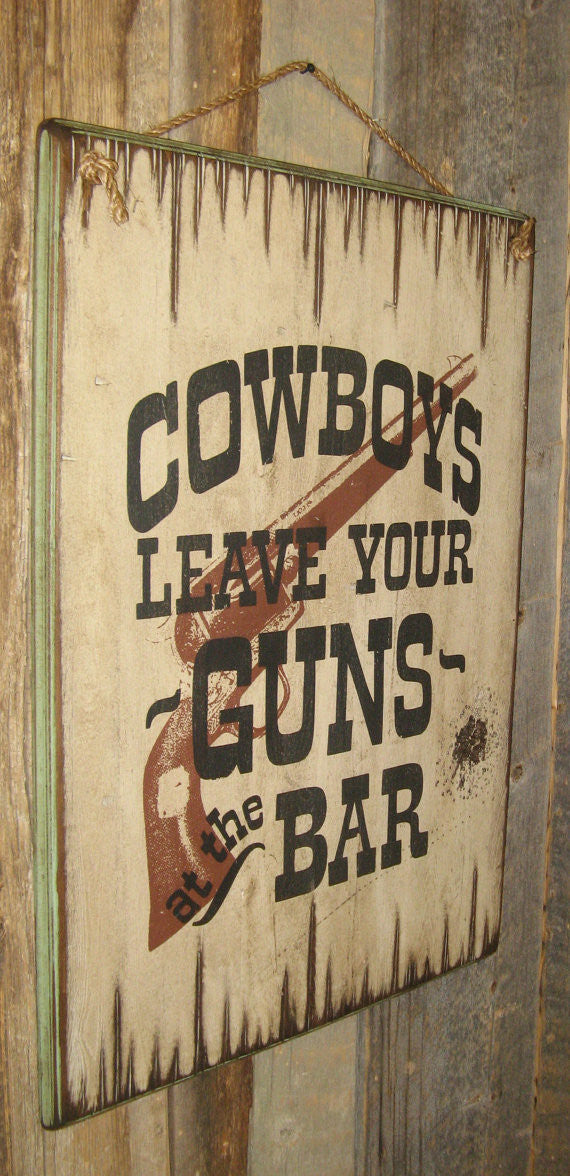 Western Wall Sign Saloon: Cowboys Leave Your Guns At The Bar Left Side