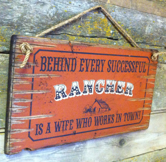 Old West Wooden Sign: Behind Every Rancher Is A Wife Who Lives In Town Left Side