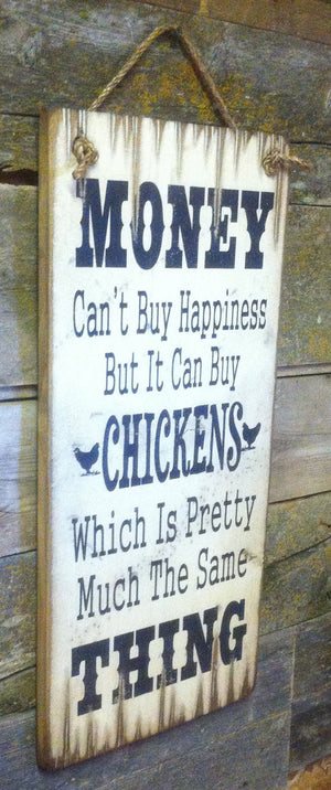 Western Wall Sign Money: Money Can't Buy Happiness But It Can Buy Chickens Left View