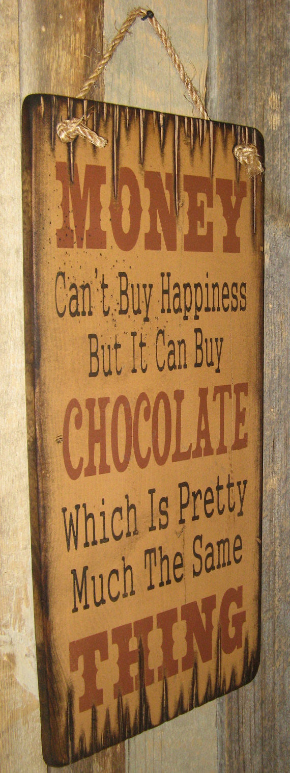 Western Wall Sign Money: Money Can't Buy Happiness But It Can Buy Chocolate Left View