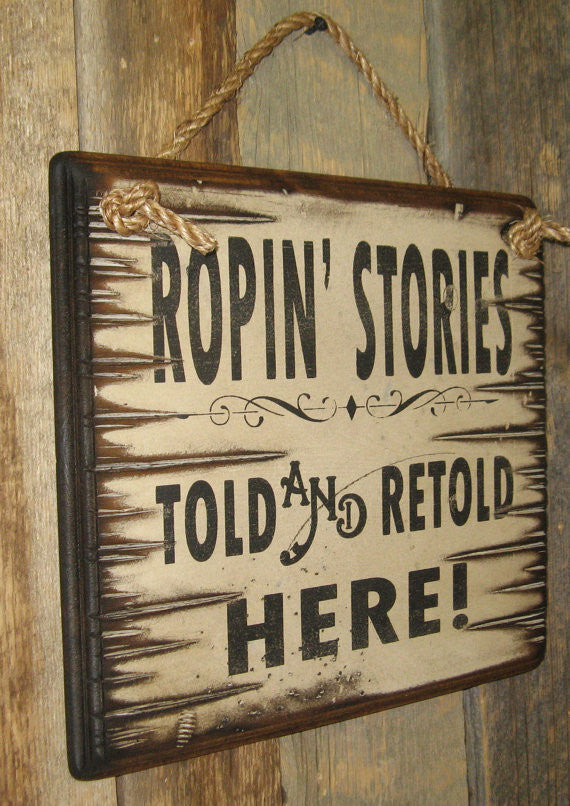 Western Wall Sign Rodeo: Ropin' Stories Told and Retold Here Left View