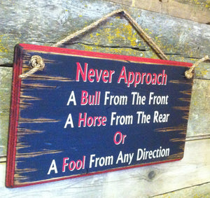 Western Wall Sign: Never Approach A Bull From The Front Left Side